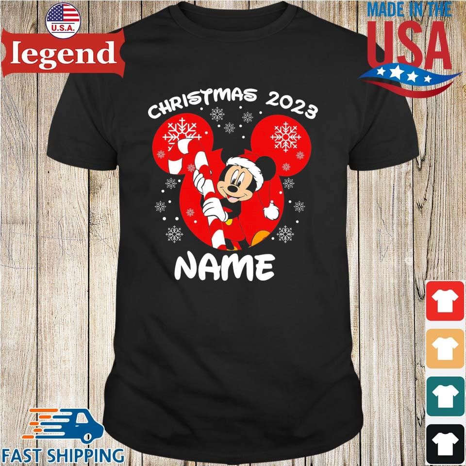 https://images.legendusashirt.com/2023/10/Disney-Christmas-2023-Your-Name-Santa-Mickey-Mouse-And-Minnie-Mouse-Xmas-Disneyland-Trip-Shirt-den-min.jpg